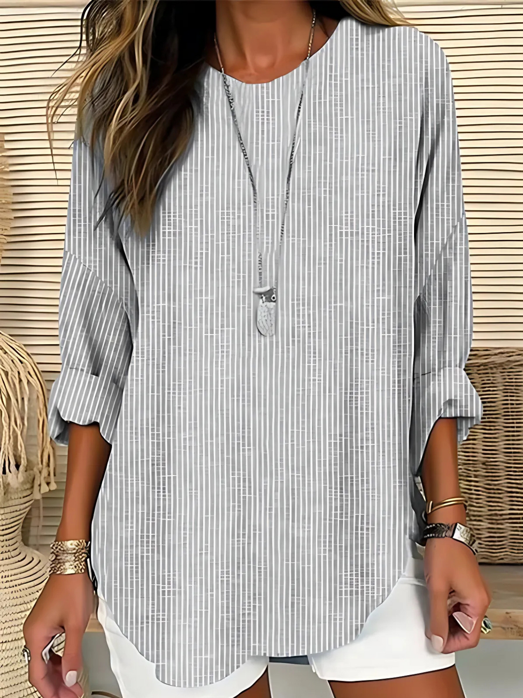 Comfortable women's relaxed striped long sleeve top with a round neck, ideal for everyday casual wear and versatile style.