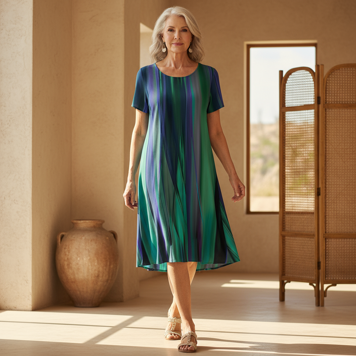 Women's relaxed fit striped swing dress. Effortless flowy design perfect for casual summer wear.