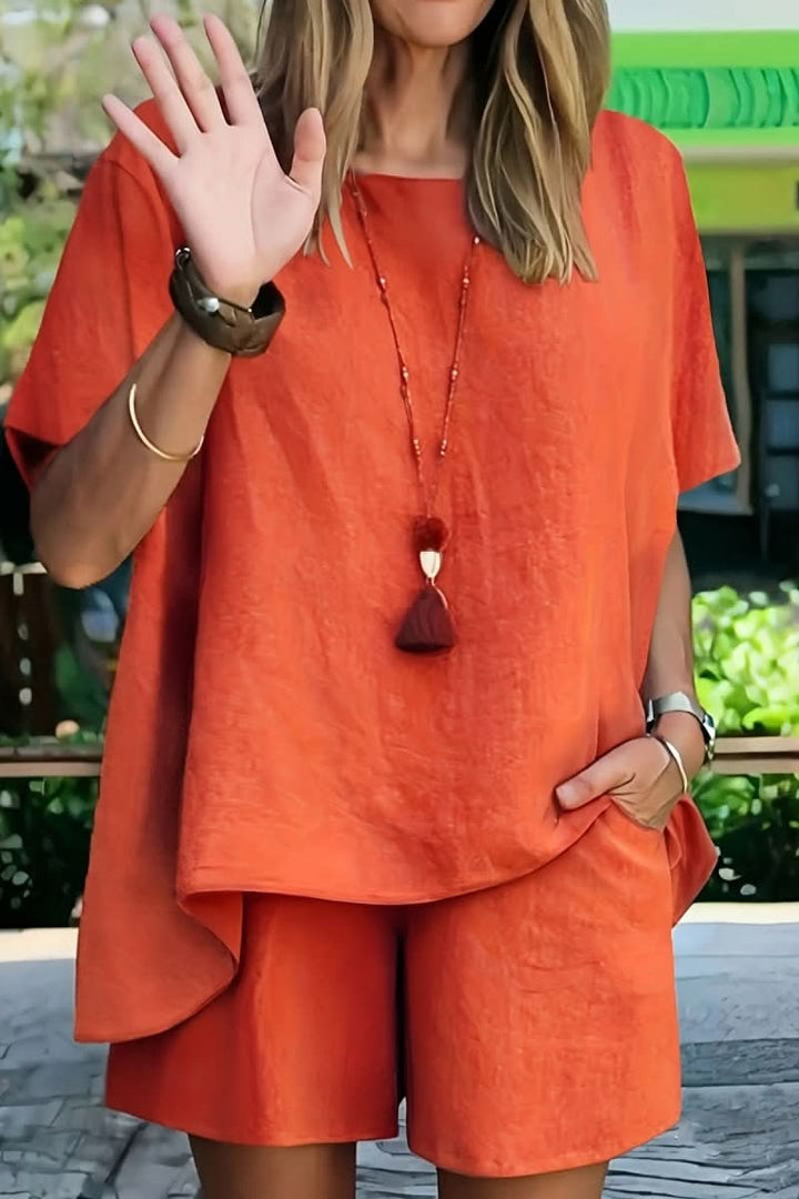 Relaxed summer two-piece outfit for women. Casual solid color shorts set, offering comfort and style for leisure.