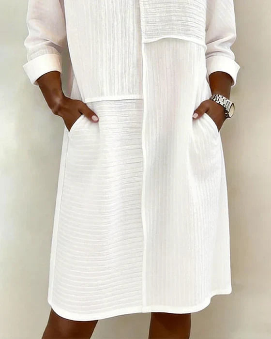 Comfortable women's relaxed fit 3/4 sleeve textured shift dress with practical pockets.