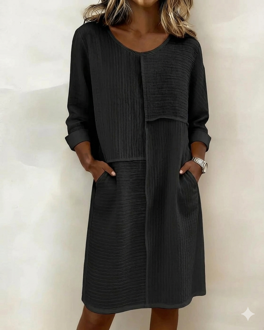 Versatile women's textured shift dress, relaxed fit, pockets, perfect for casual or elegant occasions.