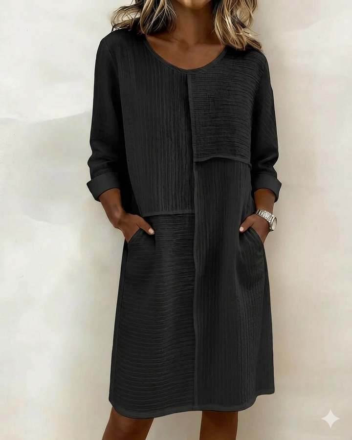 Versatile women's textured shift dress, relaxed fit, pockets, perfect for casual or elegant occasions.