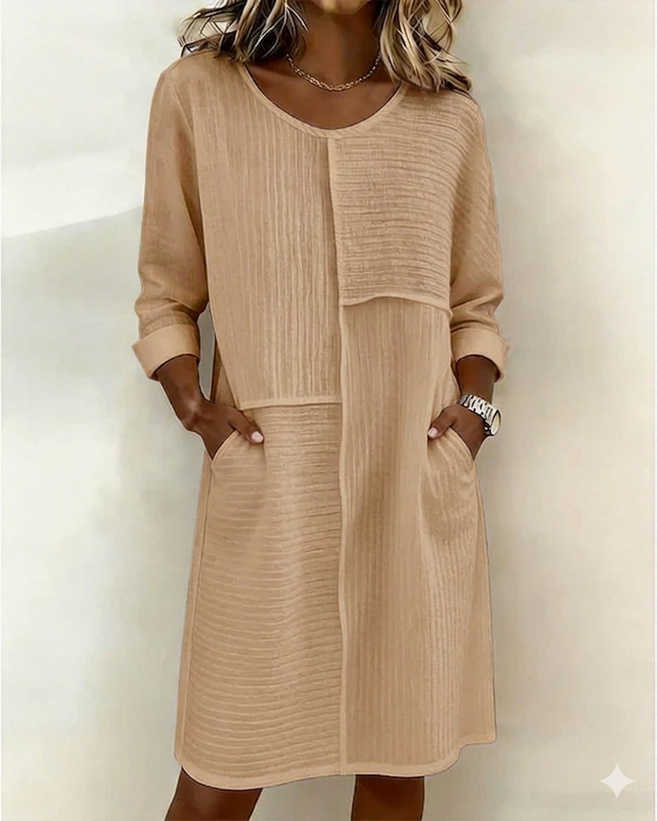 Stylish women's textured shift dress, relaxed fit with pockets. Soft, comfortable, and fashionable everyday wear.
