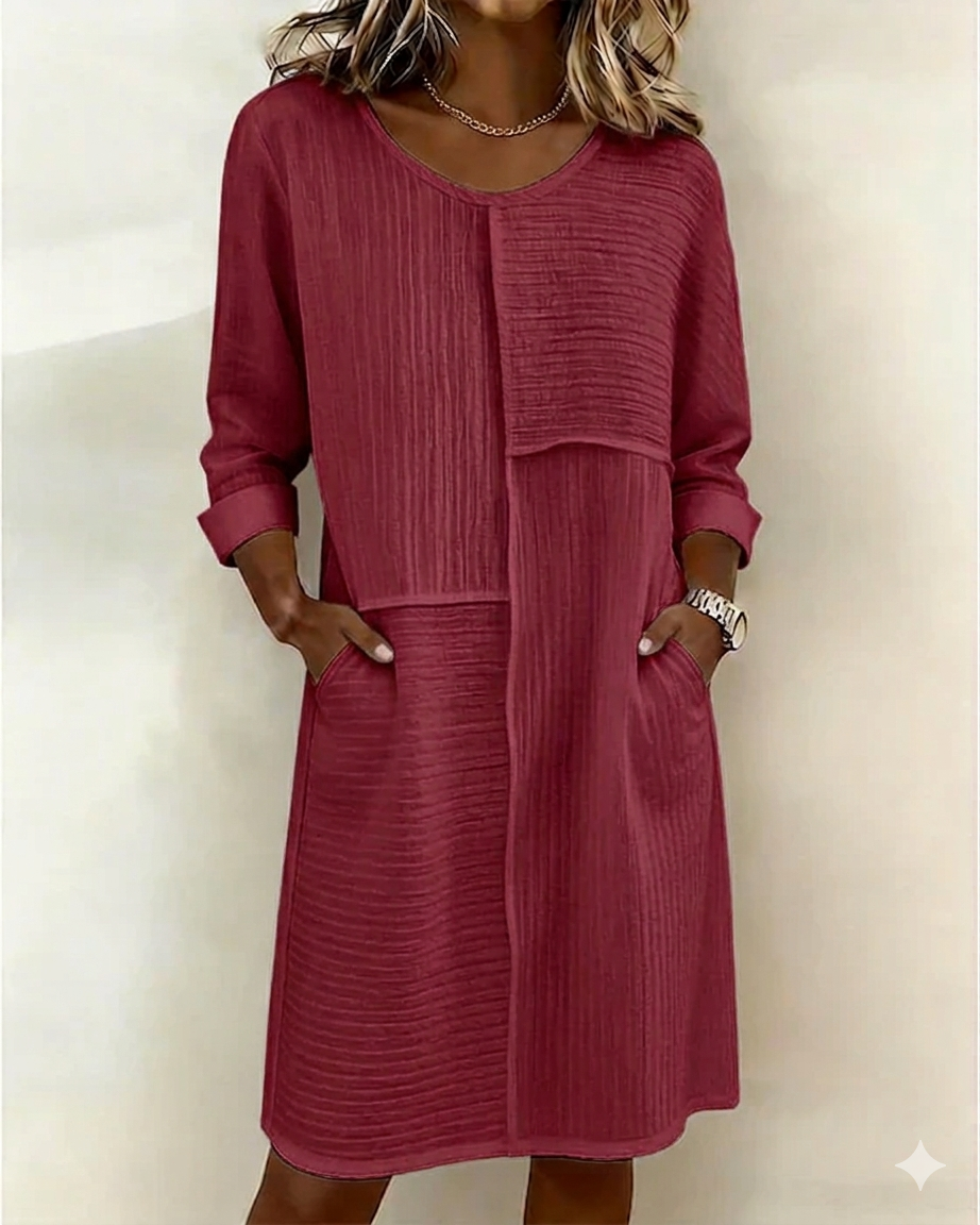 Women's relaxed fit textured shift dress featuring useful pockets & 3/4 sleeves. A versatile, comfortable fashion choice.
