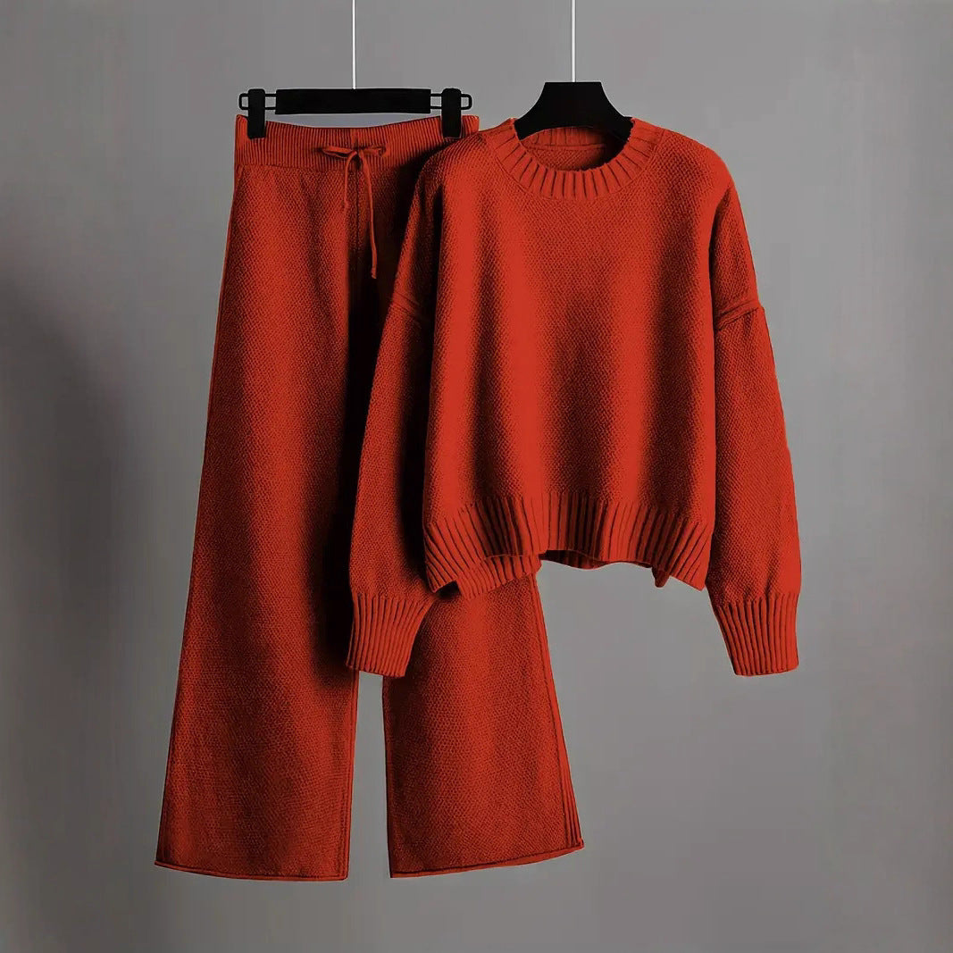 Women's relaxed fit two-piece lounge set with cropped top and wide leg pants. Comfortable casual outfit.
