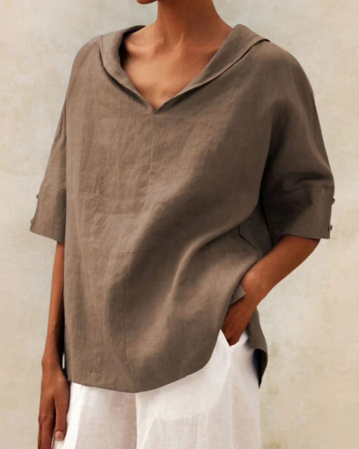 Stylish women's V-neck short sleeve blouse in a relaxed fit, a comfortable casual top for any summer occasion.