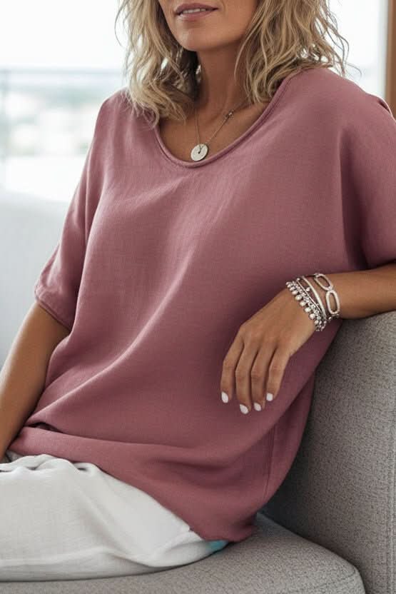 Lightweight women's summer blouse, featuring a V-neck and relaxed fit for comfortable everyday fashion.