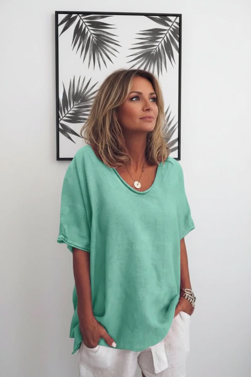 Effortless women's V-neck summer blouse, a relaxed fit top for stylish casual warm weather outfits.