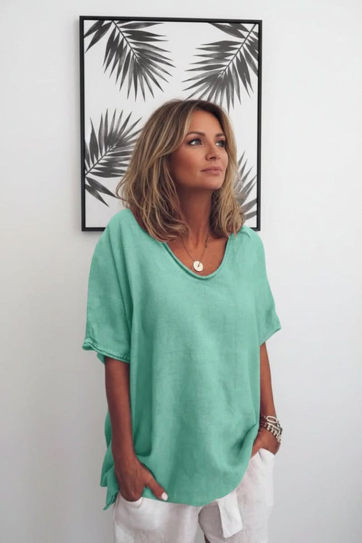 Effortless women's V-neck summer blouse, a relaxed fit top for stylish casual warm weather outfits.