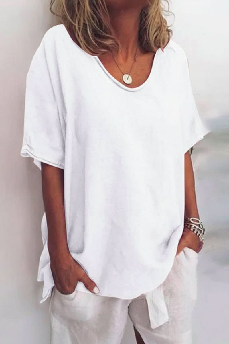 Relaxed fit women's summer blouse with V-neck, a stylish lightweight top for warm weather fashion.