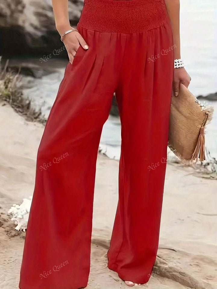 Close-up of fabric on women's relaxed wide leg pants, highlighting linen blend for summer comfort.