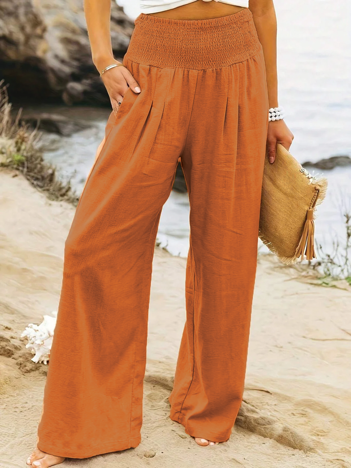 Stylish women's wide leg trousers, offering a relaxed fit for versatile and comfortable summer outfits.
