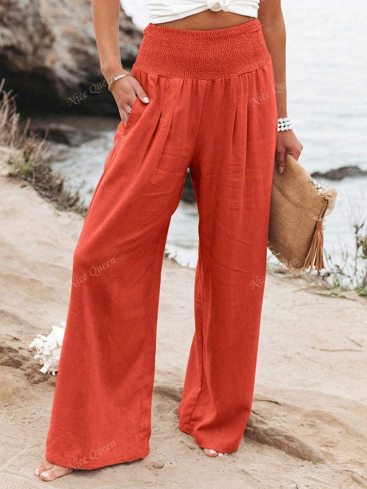 Full length shot of women's relaxed wide leg pants, showcasing their flowy design and summer appeal.