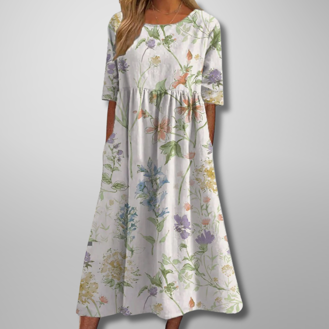 Women's midi dress with vibrant floral print and relaxed fit, ideal for summer fashion.