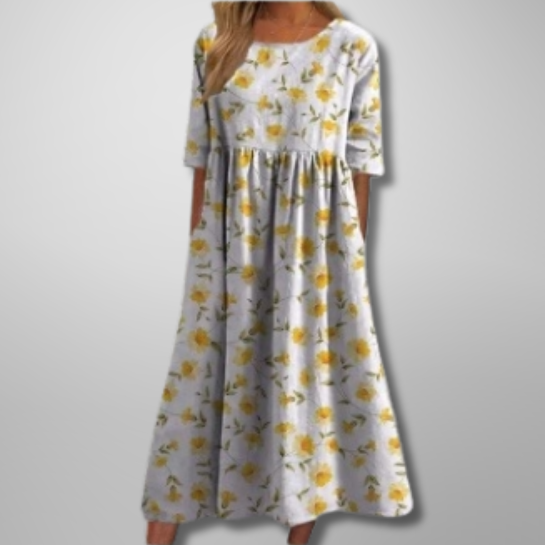 Close-up of the delicate floral pattern on a women's relaxed fit midi dress for spring fashion.