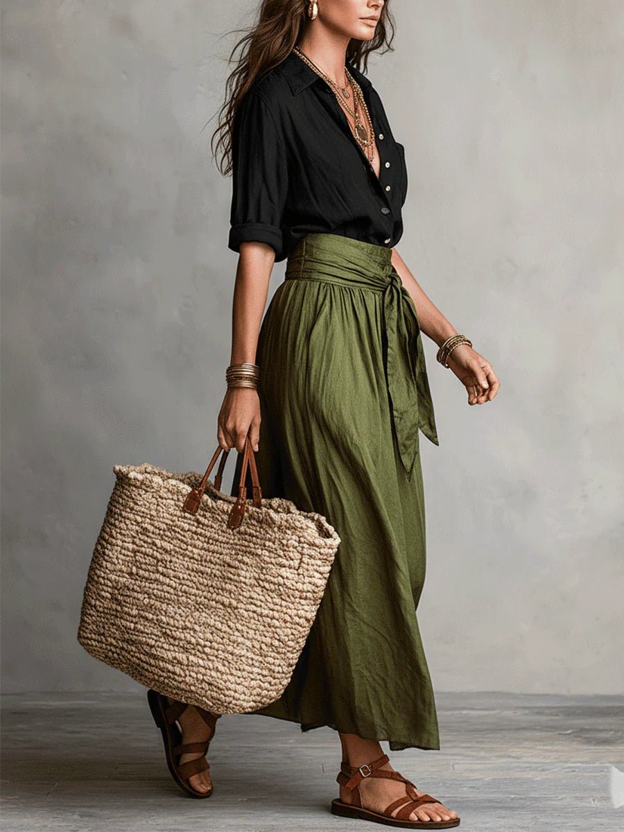 Flowy green two-piece maxi skirt set for women, featuring a button-front top and tie-waist, ideal for resort wear.