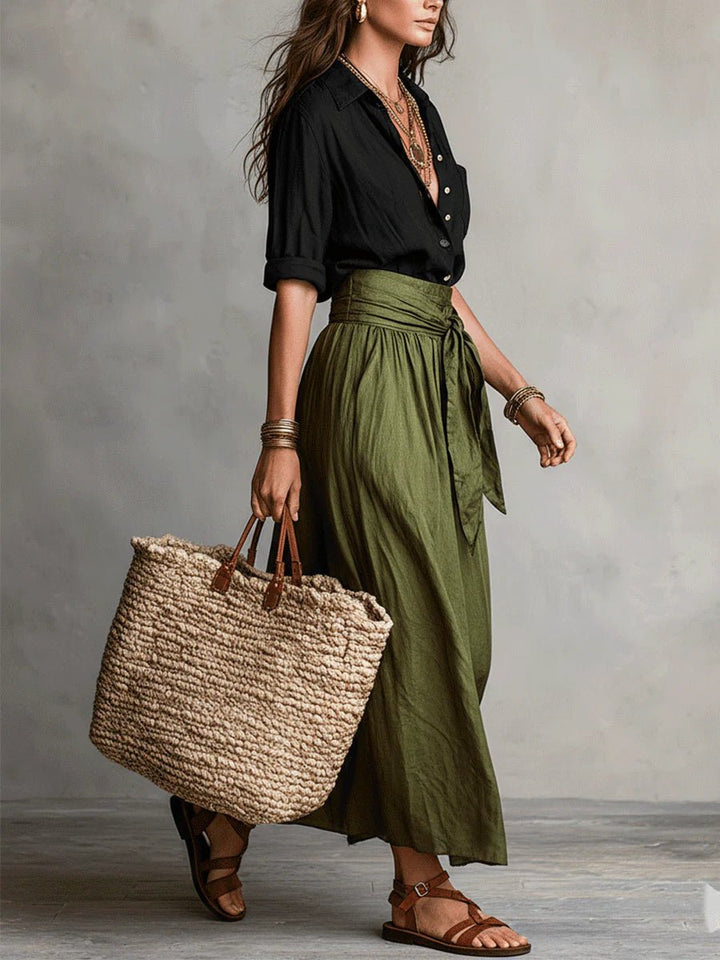 Flowy green two-piece maxi skirt set for women, featuring a button-front top and tie-waist, ideal for resort wear.