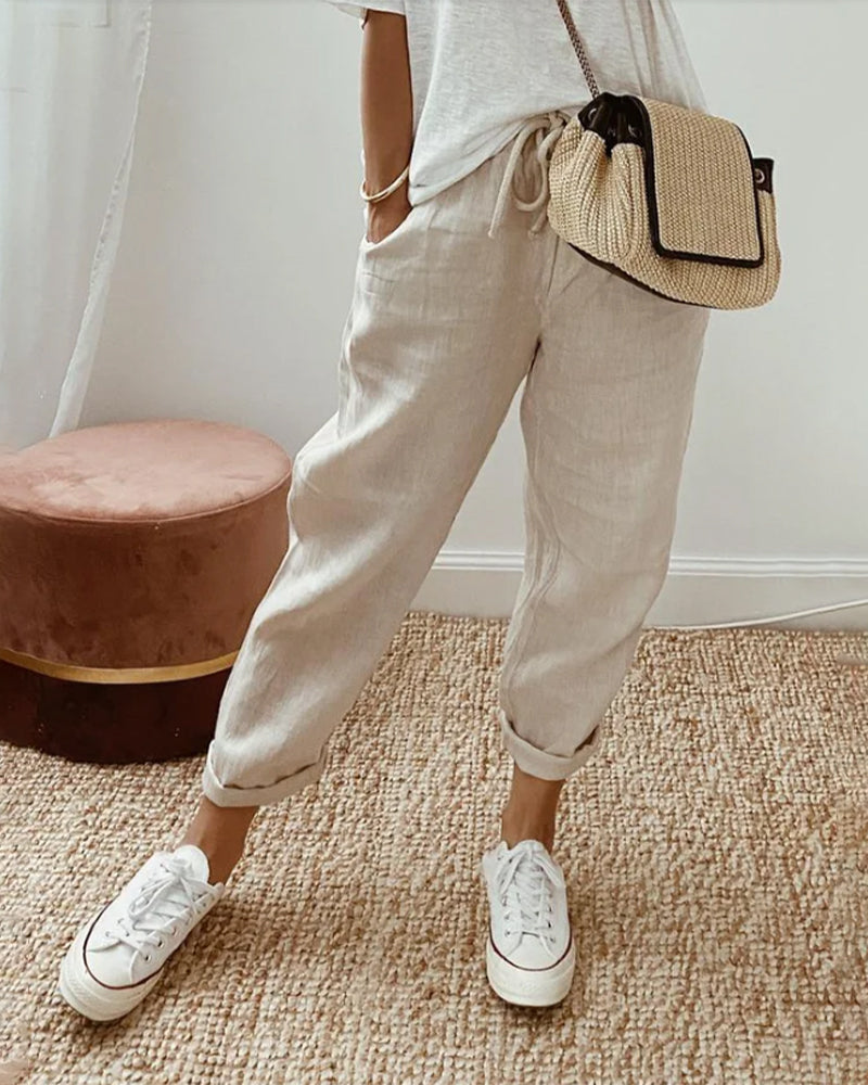 Women's relaxed linen jogger pants with a drawstring waist & stylish roll cuff, perfect for casual summer comfort.