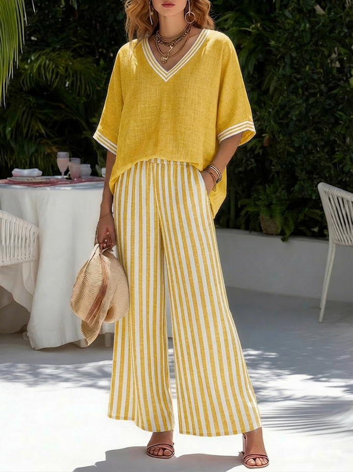 Comfortable women's striped two-piece: V-neck shirt & wide-leg pants. Great for relaxed style.