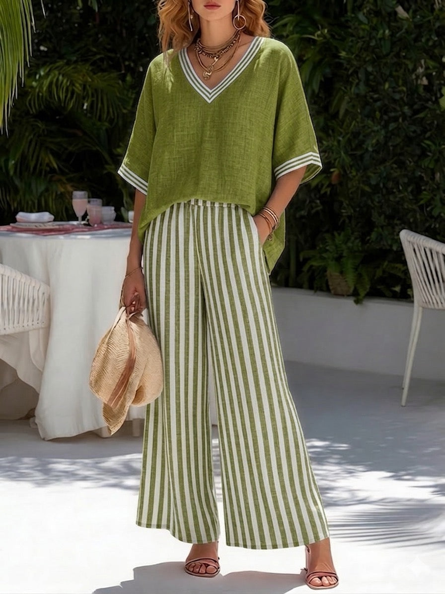 Chic women's striped two-piece set, featuring a relaxed shirt and flowy wide-leg pants for summer.