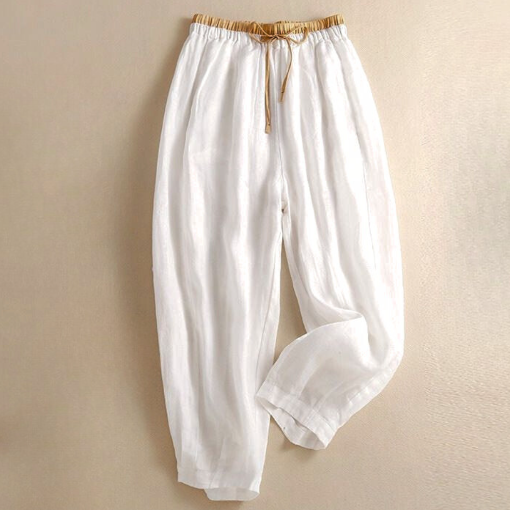 Side profile of women's comfortable linen trousers, highlighting the relaxed fit and casual style.
