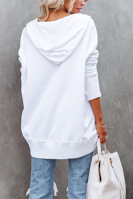 Stylish women's relaxed fit tunic top with a hood for ultimate comfort.