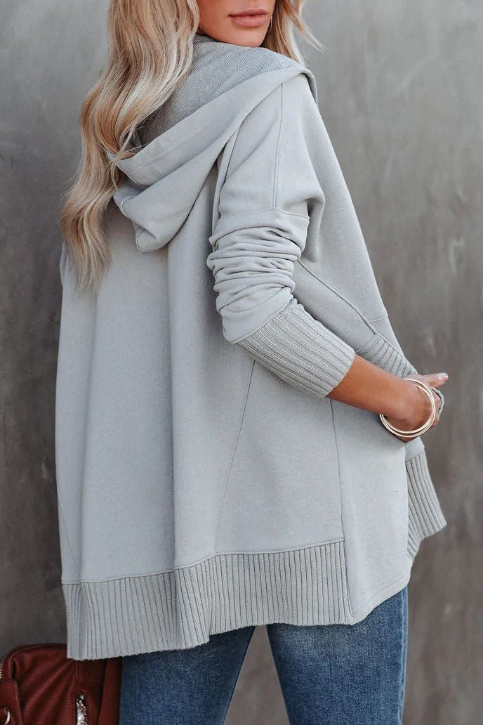 Soft women's longline pullover, a cozy hooded sweatshirt for relaxed style.