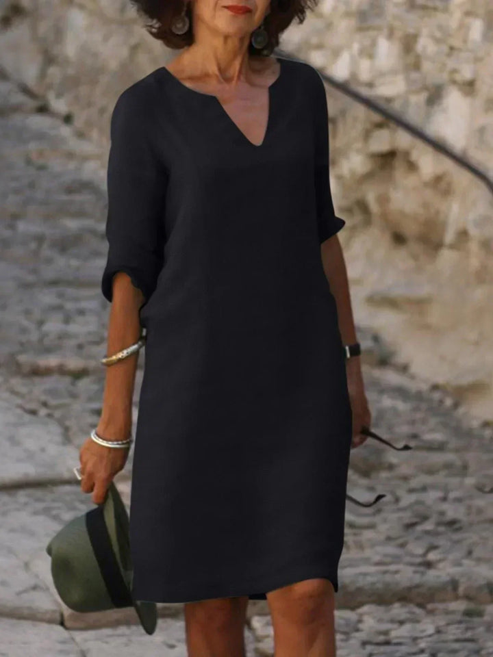 Women's relaxed V-neck midi dress with 3/4 sleeves. Casual summer style, perfect for everyday wear.
