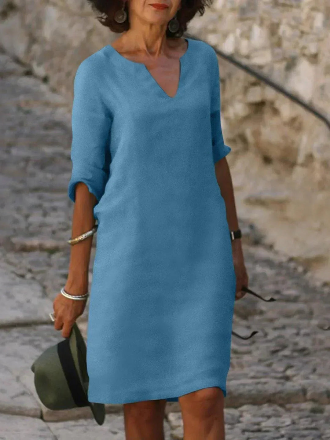Elegant women's relaxed V-neck midi dress with 3/4 sleeves. Chic, comfortable, and versatile day and evening dress.