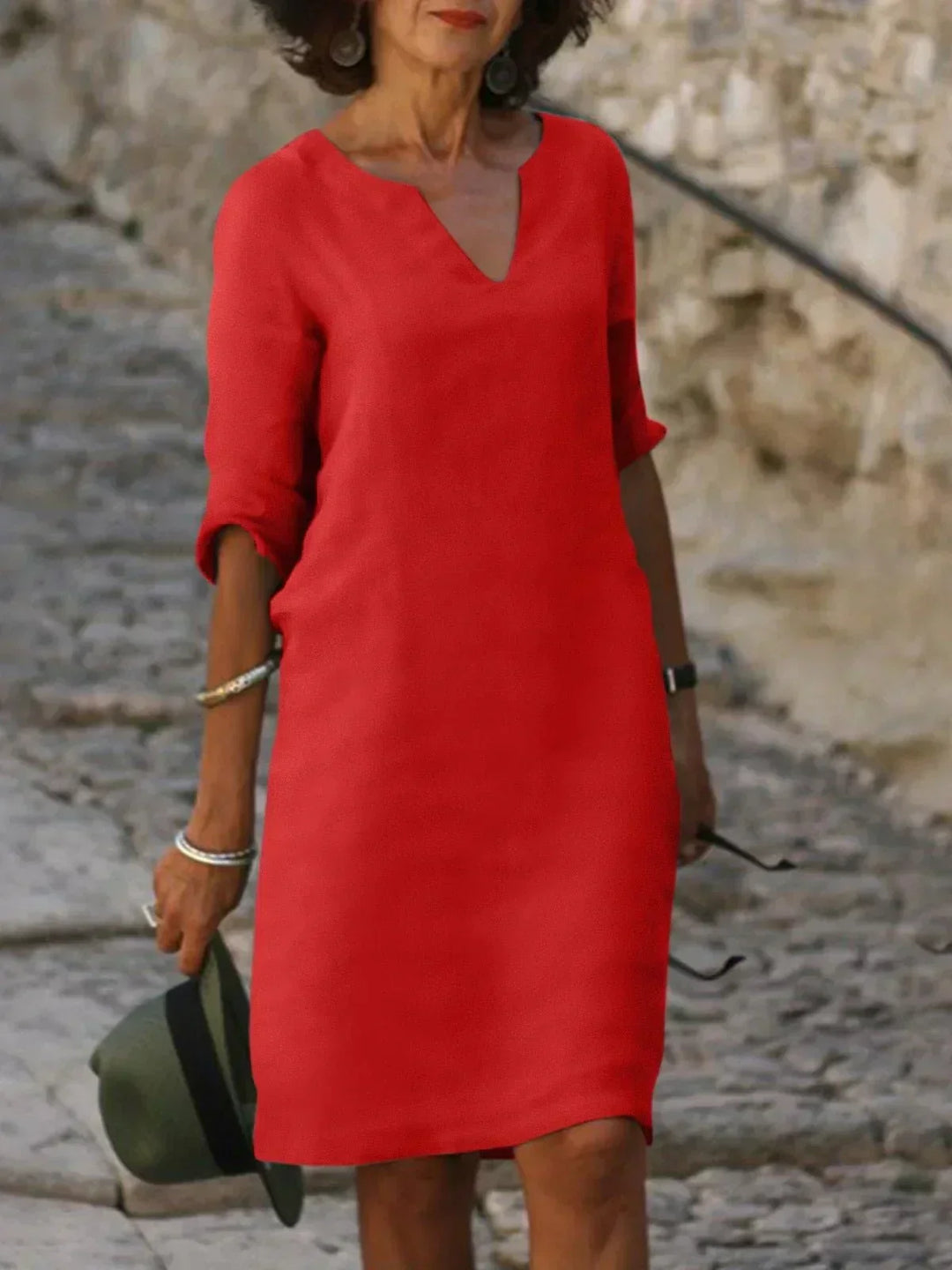 Casual women's V-neck midi dress, relaxed fit, 3/4 sleeves. Elegant day dress, perfect for any relaxed occasion.