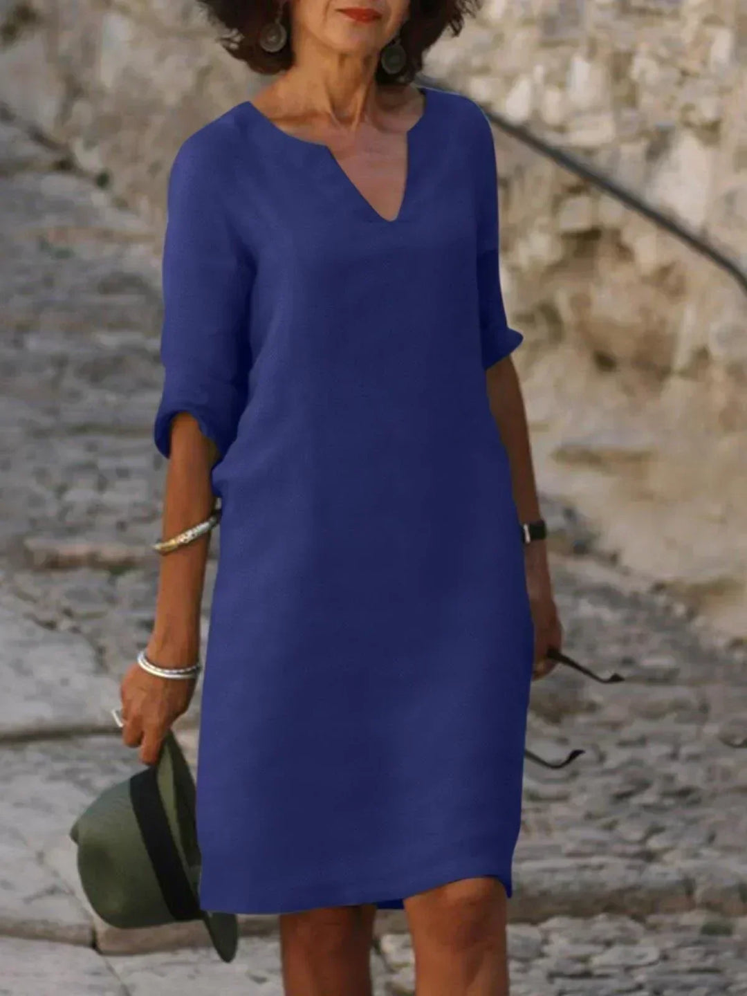 Versatile women's V-neck midi dress, relaxed fit, 3/4 sleeves. Easily transitions from day wear to evening.