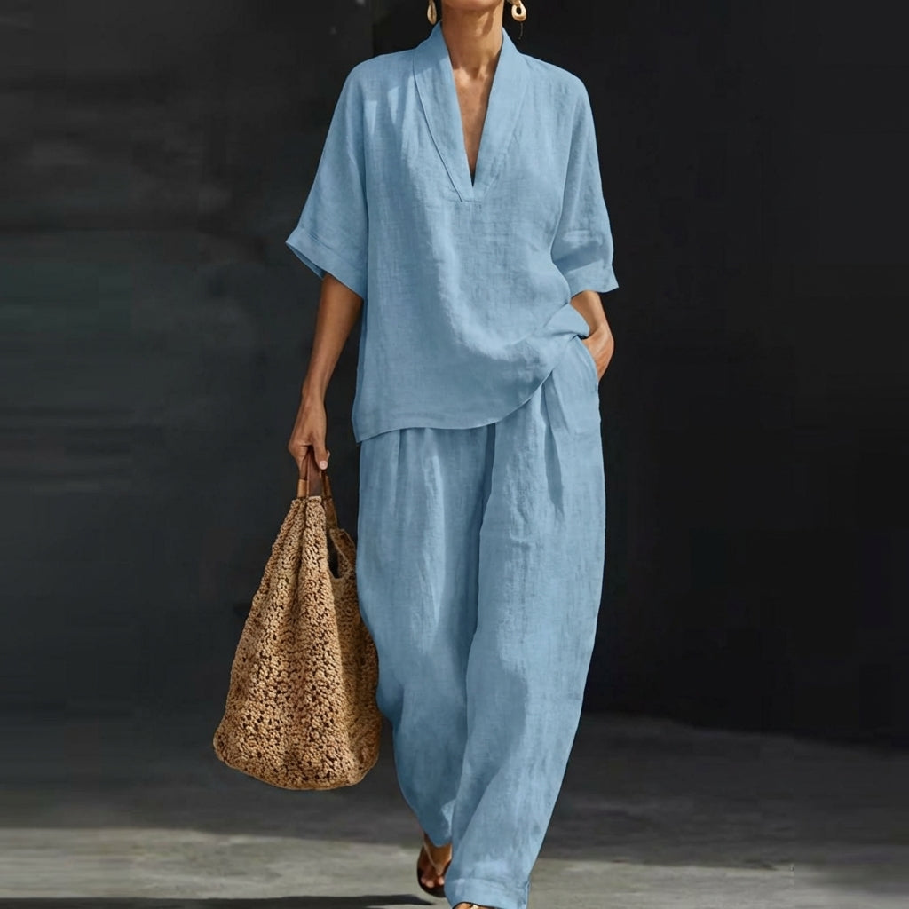Women's relaxed v-neck top & wide-leg pants set. Comfortable 2-piece outfit for loungewear or casual chic style.