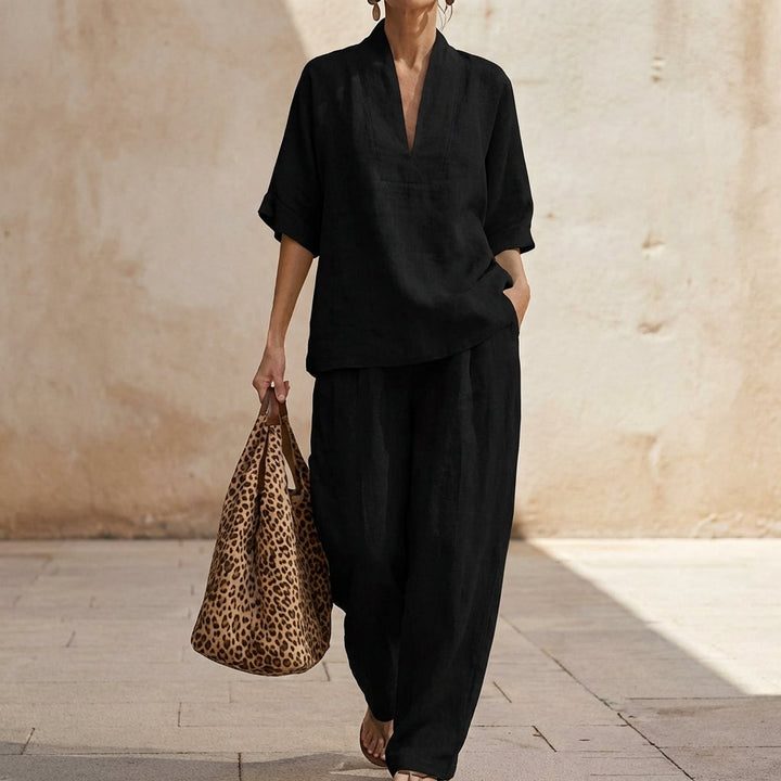 Comfortable women's two-piece outfit featuring a relaxed fit v-neck top and stylish wide-leg pants.