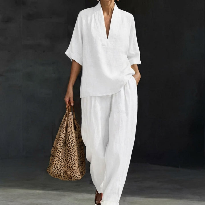 Stylish women's relaxed 2-piece set. V-neck top & wide-leg pants deliver comfortable, modern summer style.