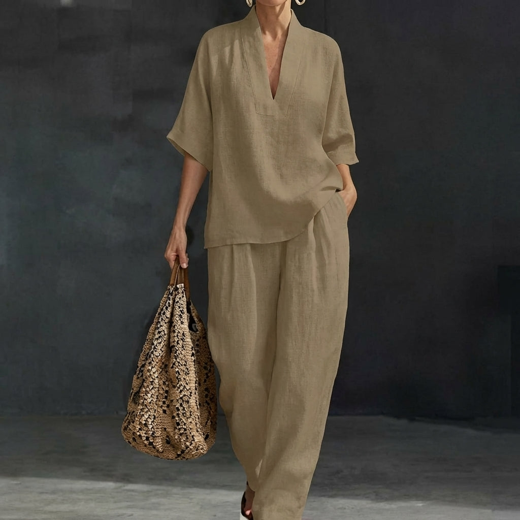 Women's relaxed fit v-neck top & wide-leg pants set. Chic two-piece loungewear for ultimate comfort.