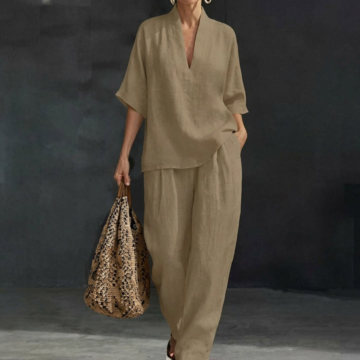 Women's relaxed fit v-neck top & wide-leg pants set. Chic two-piece loungewear for ultimate comfort.