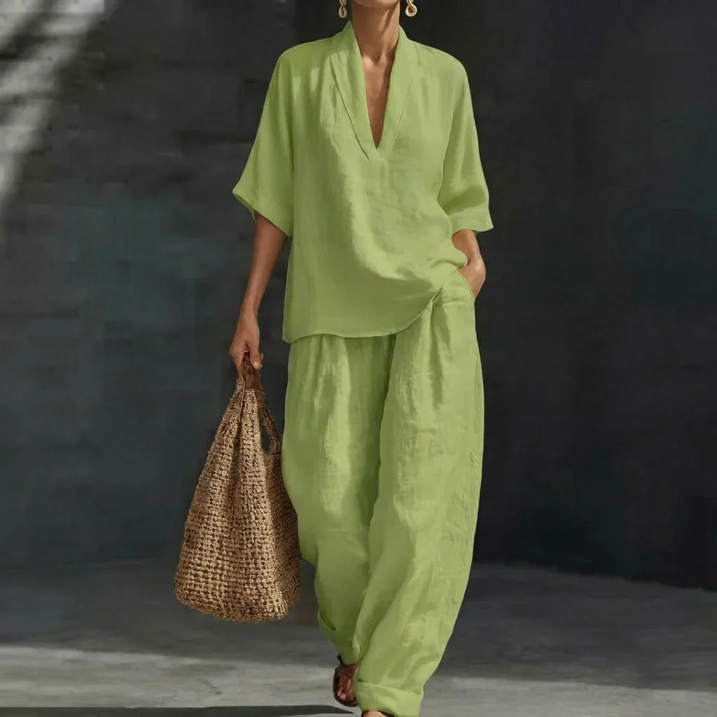 Effortless women's casual chic set. Relaxed v-neck top & flowing wide-leg pants for versatile summer fashion.