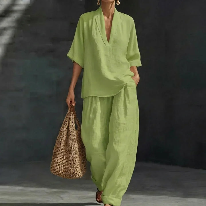 Effortless women's casual chic set. Relaxed v-neck top & flowing wide-leg pants for versatile summer fashion.
