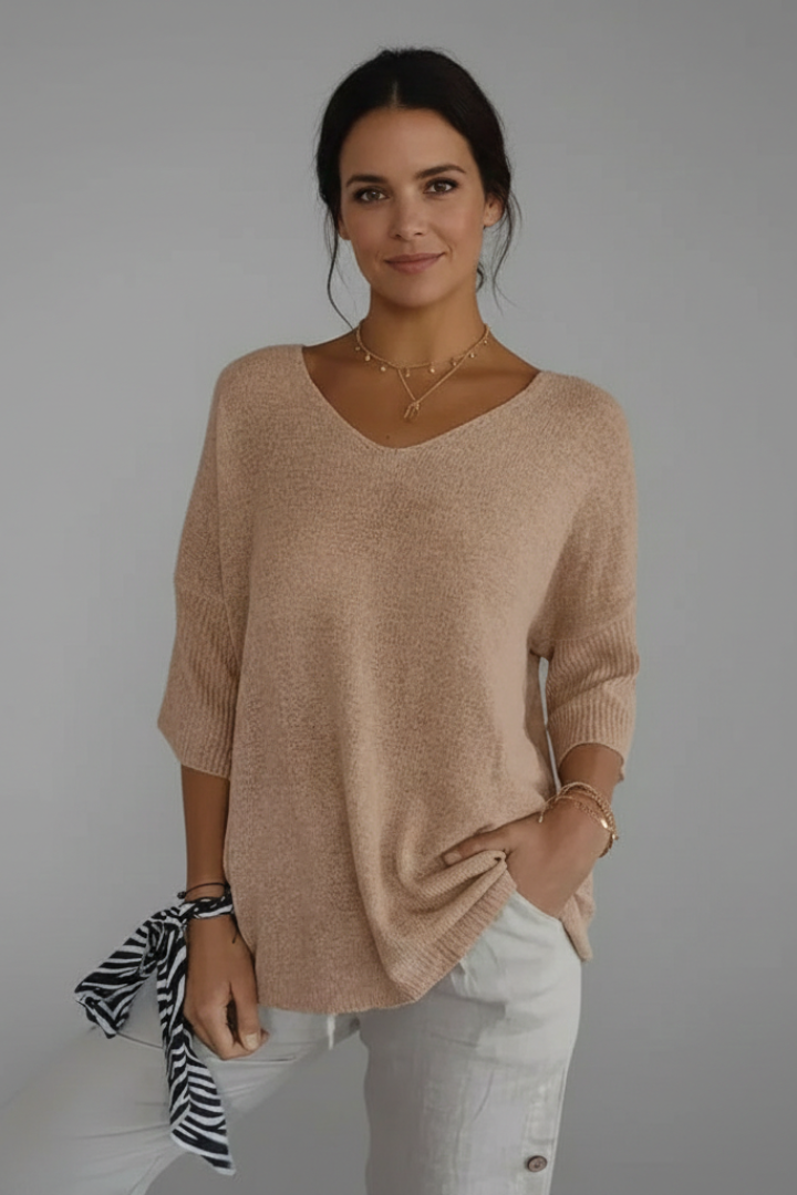 Casual women's elbow sleeve top, featuring a flattering V-neck and a comfortable relaxed fit.
