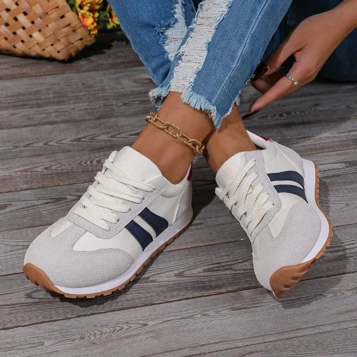 Stylish women's colourblock trainers with lace-up design, perfect for versatile casual & sporty looks.