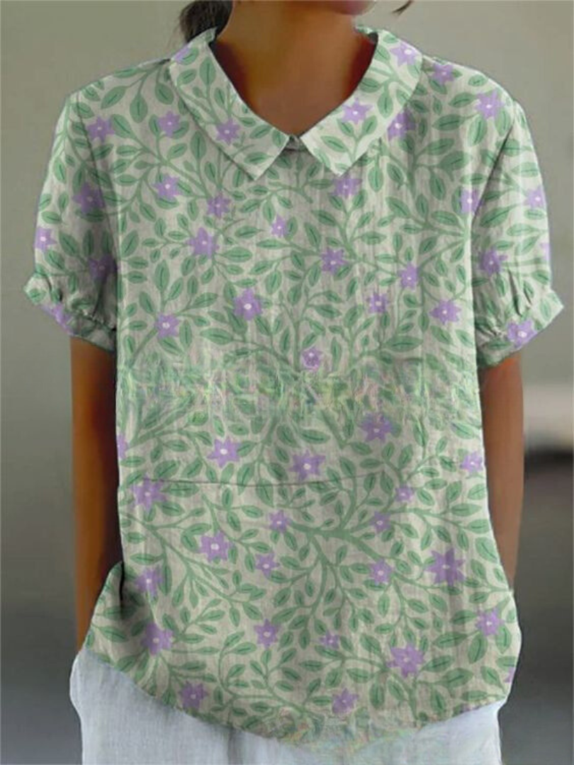 Casual elegant women's retro blouse with beautiful floral embroidery, ideal for summer outfits.