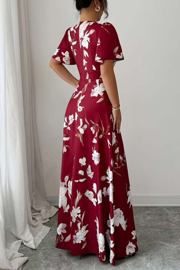 Feminine women's pleated floral midi dress with short ruffled sleeves, perfect spring/summer wear.