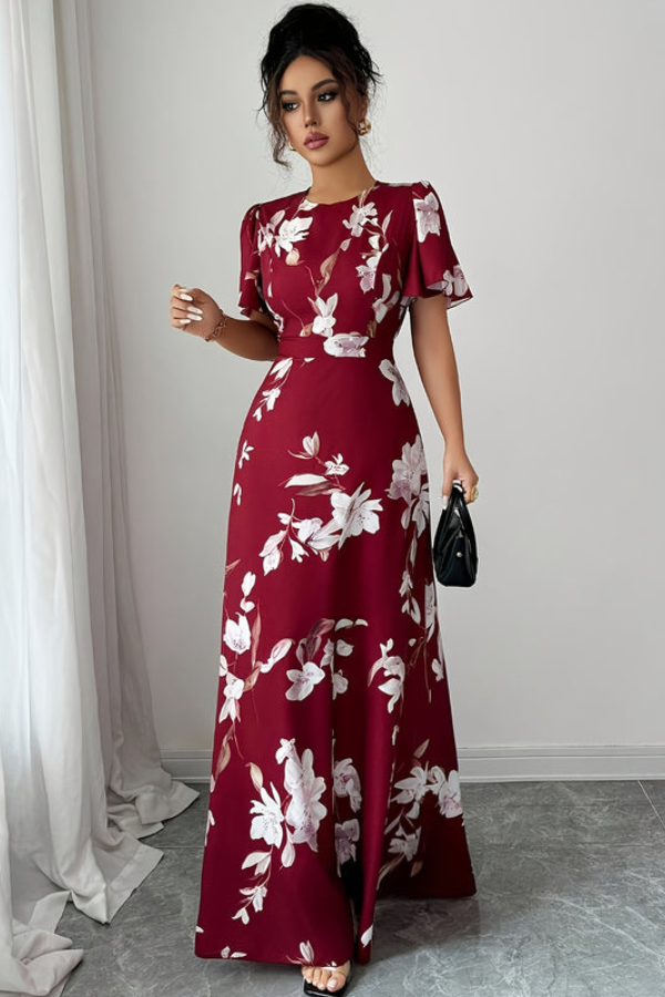 Stylish women's retro midi dress with vibrant floral print and elegant pleats, ideal for parties.