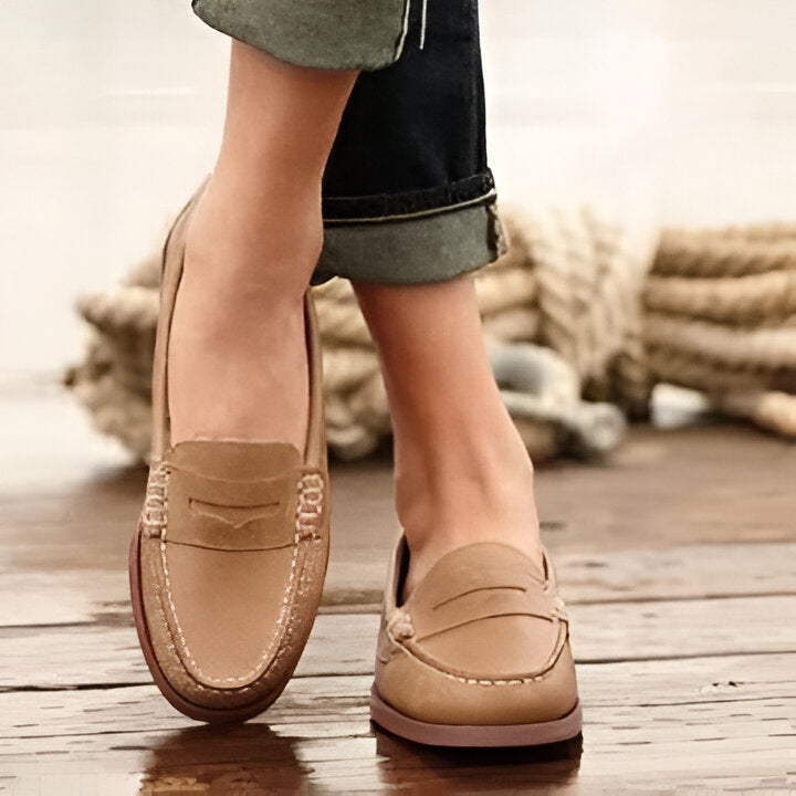 Vintage women's round toe slip-on loafers with a comfortable low heel. Classic retro style shoes for everyday wear.