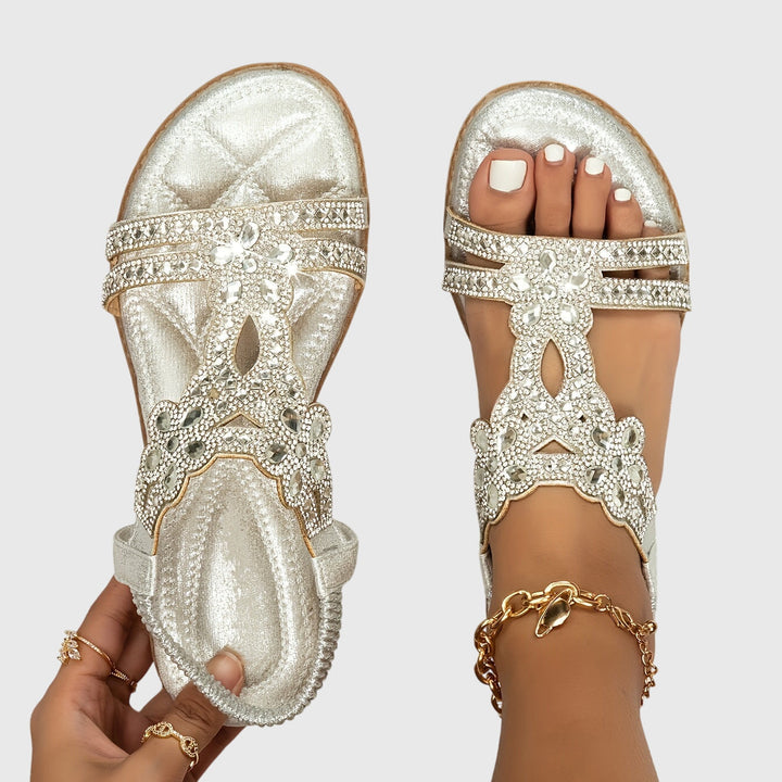 Embellished women's flat sandals with glamorous rhinestones, ultimate comfort.