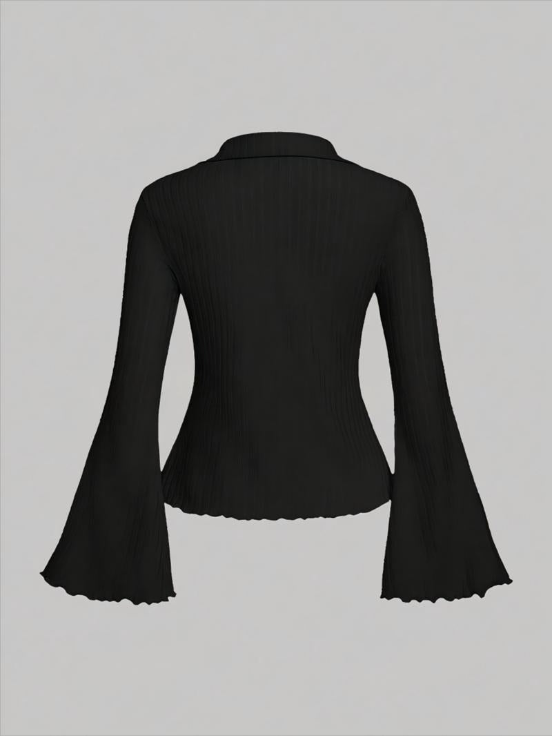 Product shot of a women's ribbed knit blouse. Cream color, prominent flared sleeves and scalloped hem detail. Casual.