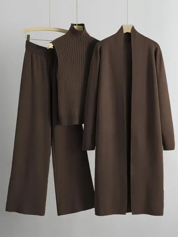 Stylish women's ribbed knit lounge set including a high-neck top, wide-leg pants, and matching long cardigan