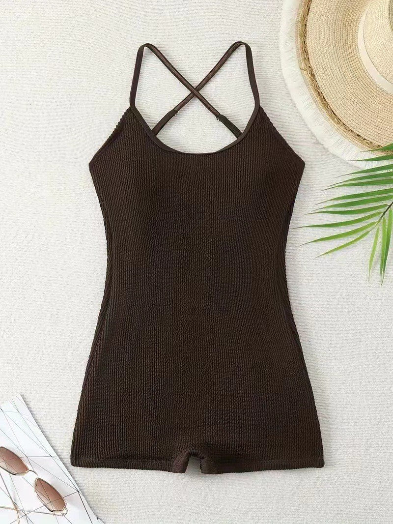 Detail shot: Ribbed texture of women's athletic monokini swimsuit, offering comfort for beach sports.