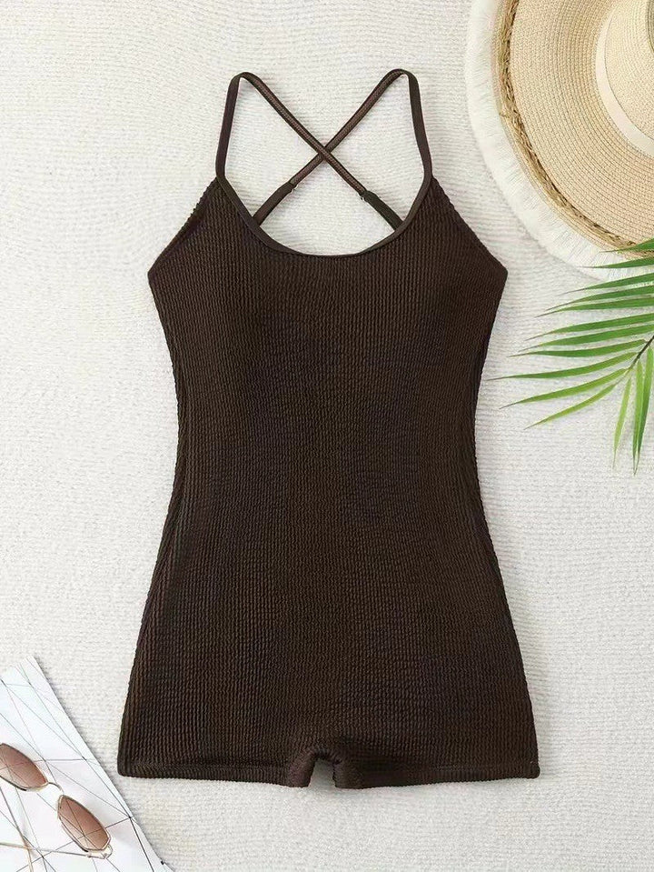 Detail shot: Ribbed texture of women's athletic monokini swimsuit, offering comfort for beach sports.