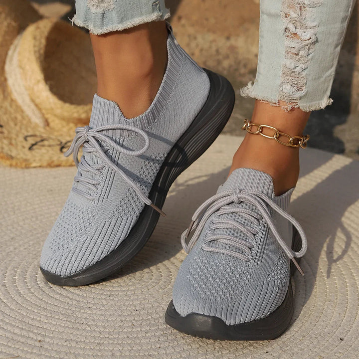 Lightweight women's casual lace-up sneakers with a ribbed sock fit for comfortable everyday footwear.